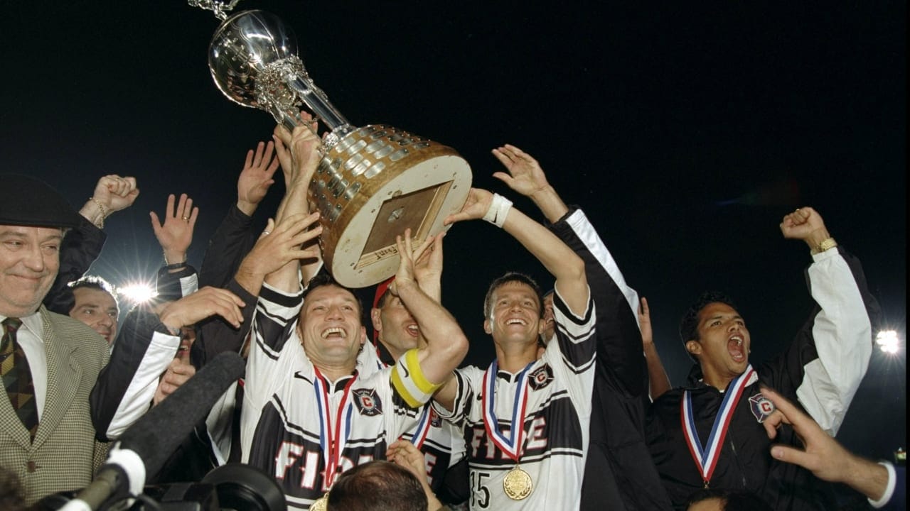 Photo of the 1998 Chicago Fire U.S. Open Cup trophy lift wearing the 1998 away kit.