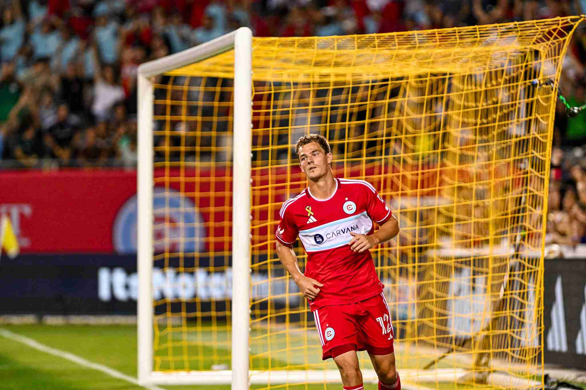 Tom Barlow close in shot after scoring a goal with the net in the background