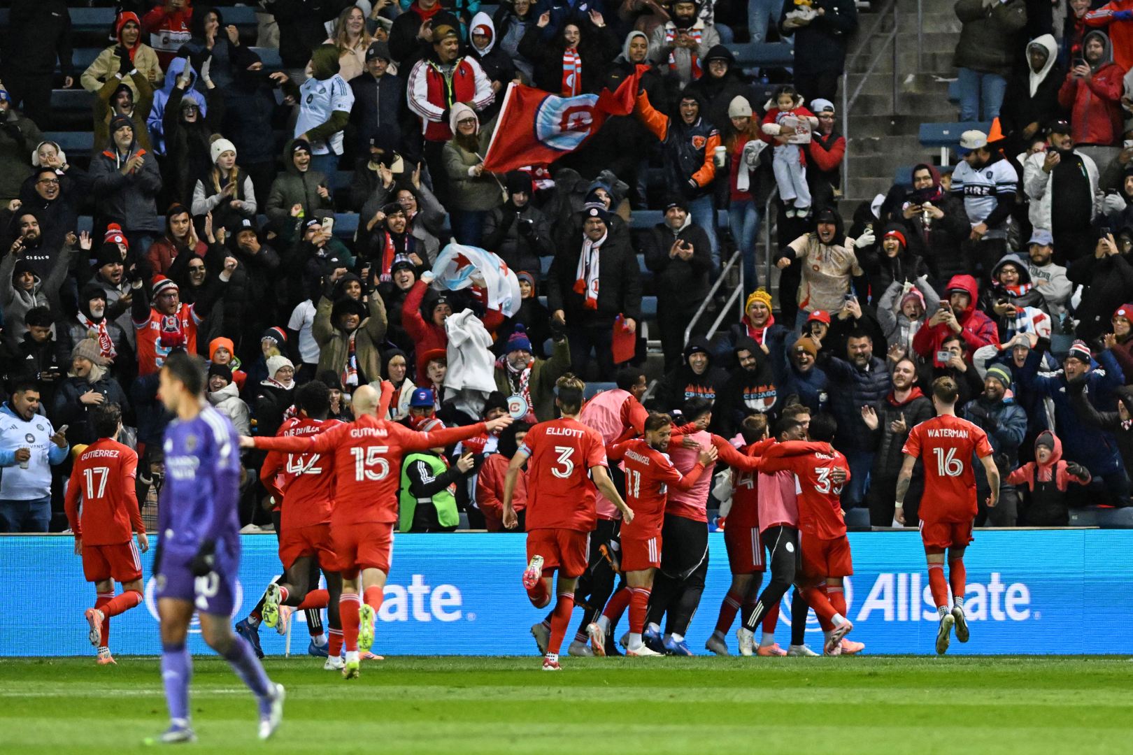 Chicago Fire players rush to the supporters to celebrate a goal the Chicago Fire's playoff game against Orlando City at SeatGeek Stadium on October 22, 2025