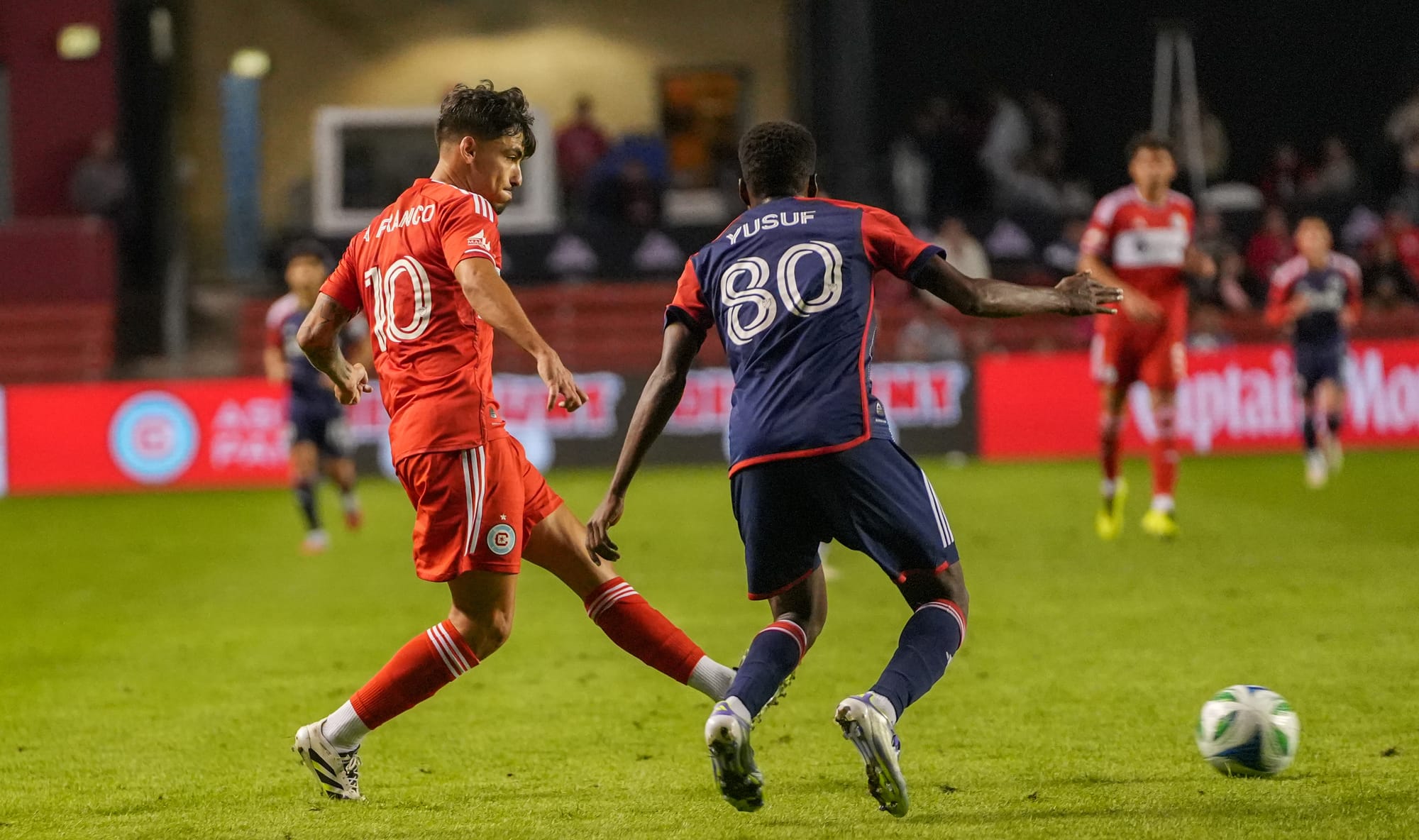 André Franco of the Chicago Fire playing the ball against New England Revolution's Alhassan Yusuf at SeatGeek staidum on September on September 5 2025