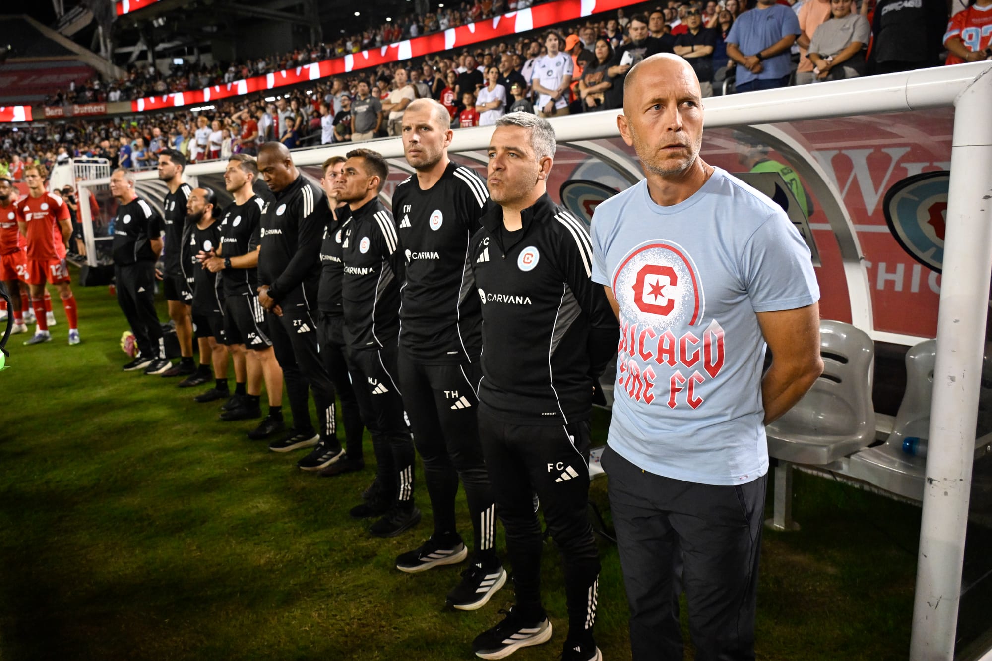 Gregg Berhalter before an MLS match against Toronto FC at Soldier Field, alongside Filipe Çelikkaya, Hector Jiménez, and the rest of his coaching staff.