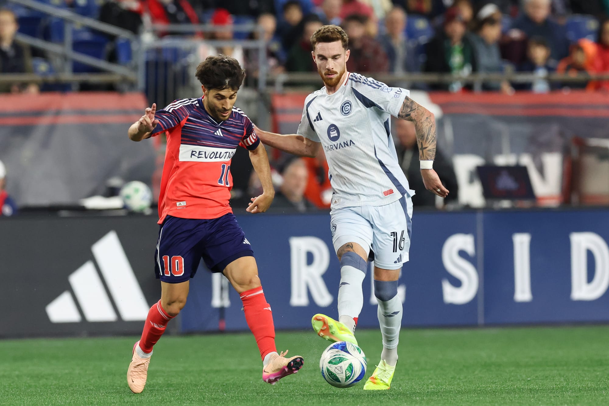 Joel Waterman duels Carles Gil of the New England Revolution on MLS Decision Day 2025 at Gillette Stadium.