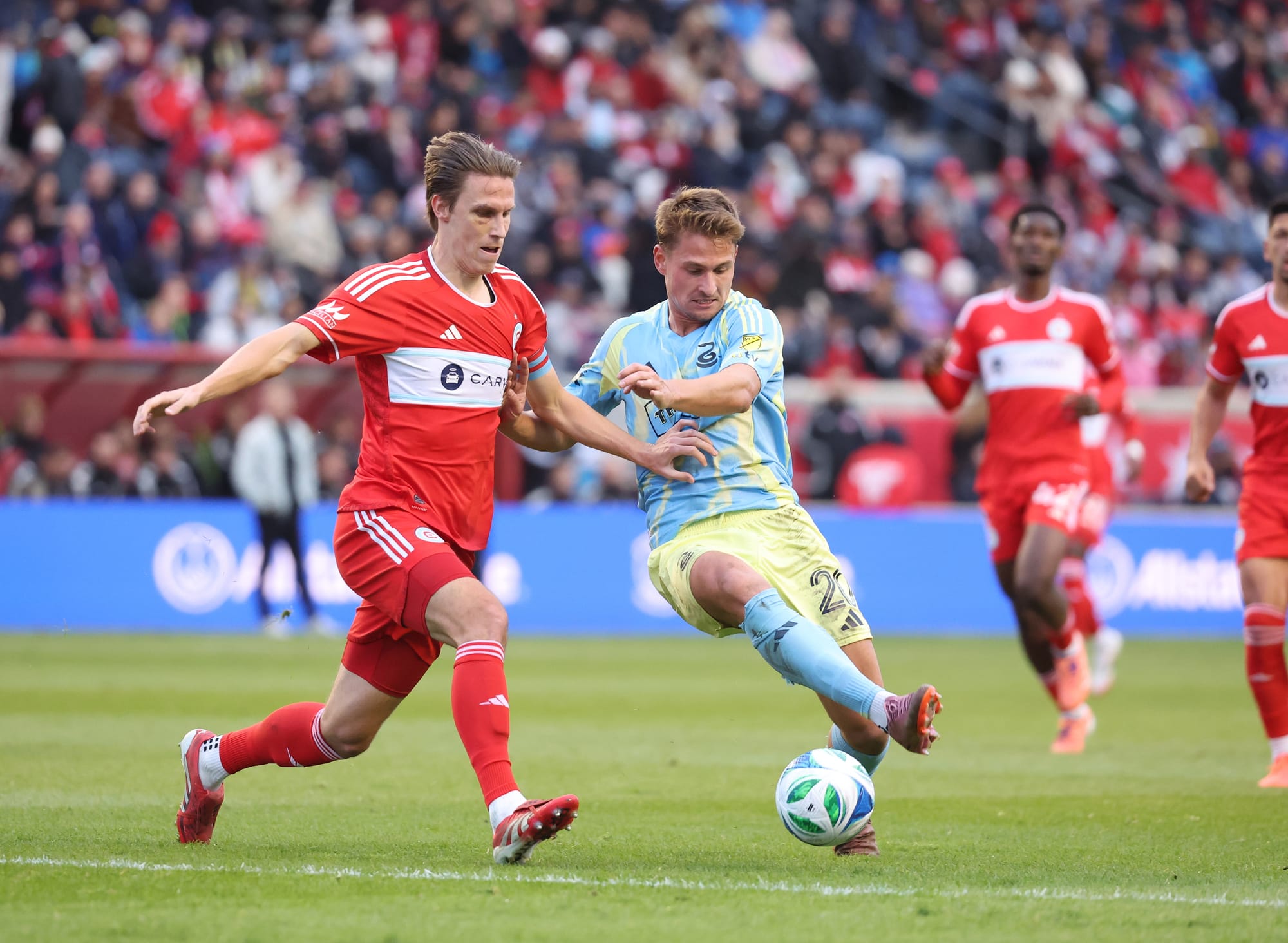 Chicago Fire's Jack Elliott battles a Philadelphia Union player in the MLS Cup Playoffs First Round Game 2 at SeatGeek Stadium in Bridgeview.