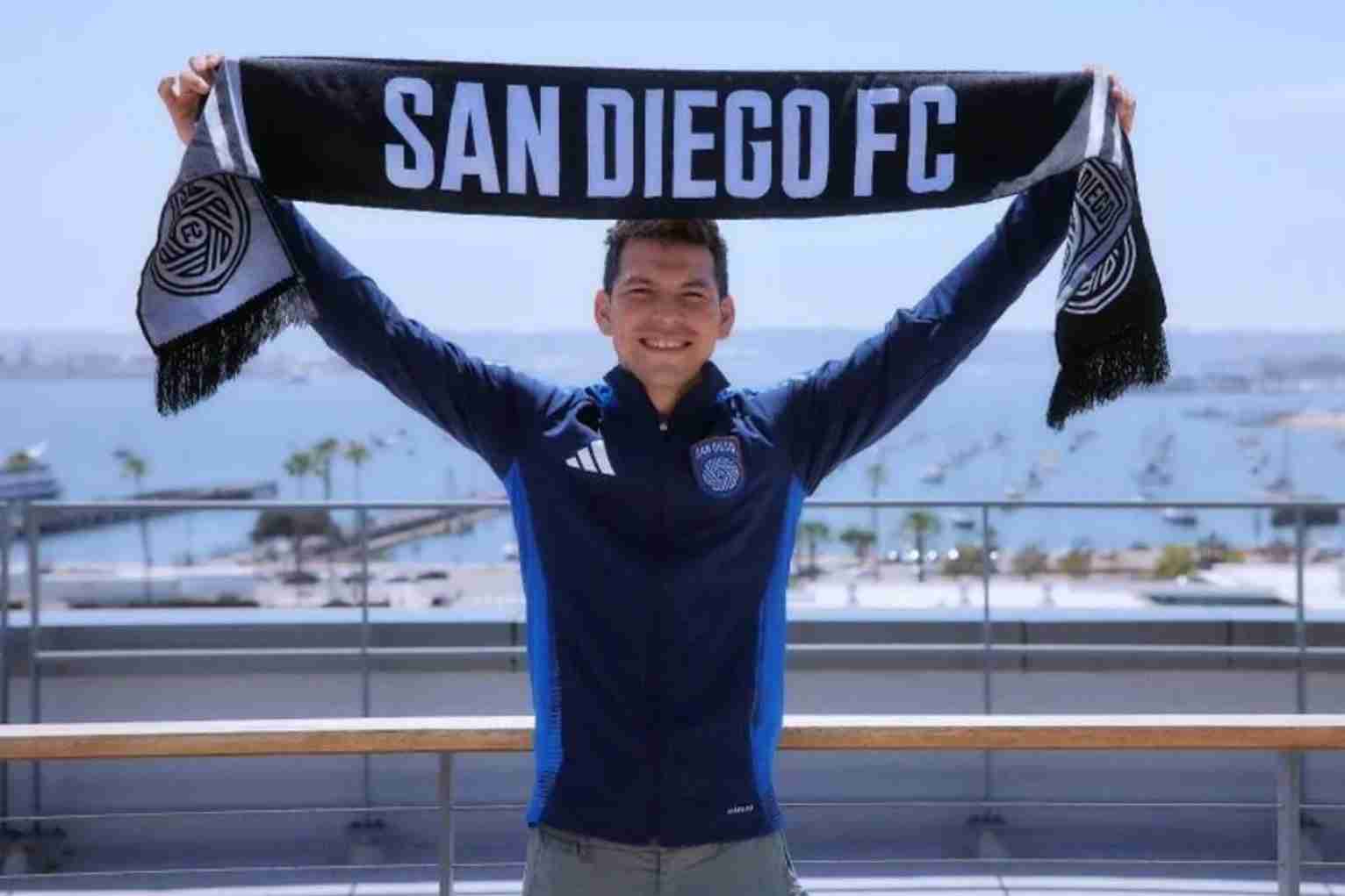 Chucky Lozano holding up a "San Diego FC" scarf