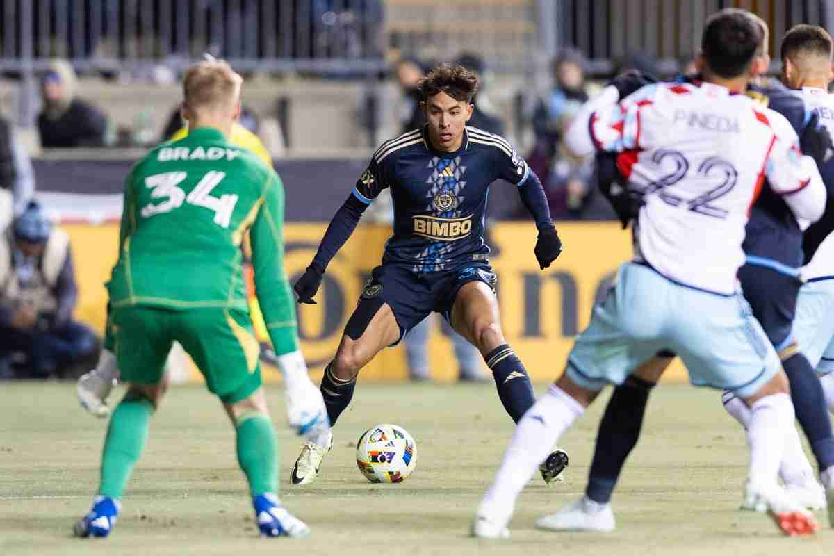 Feb 24, 2024; Philadelphia, Pennsylvania, USA; Philadelphia Union midfielder Quinn Sullivan (33) controls the ball in front of Chicago Fire FC goalkeeper Chris Brady (34) during the second half at Subaru Park.