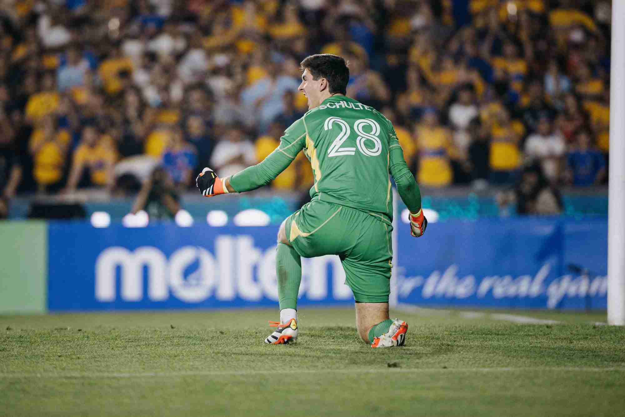 Goalkeeper Patrick Schulte celebrates