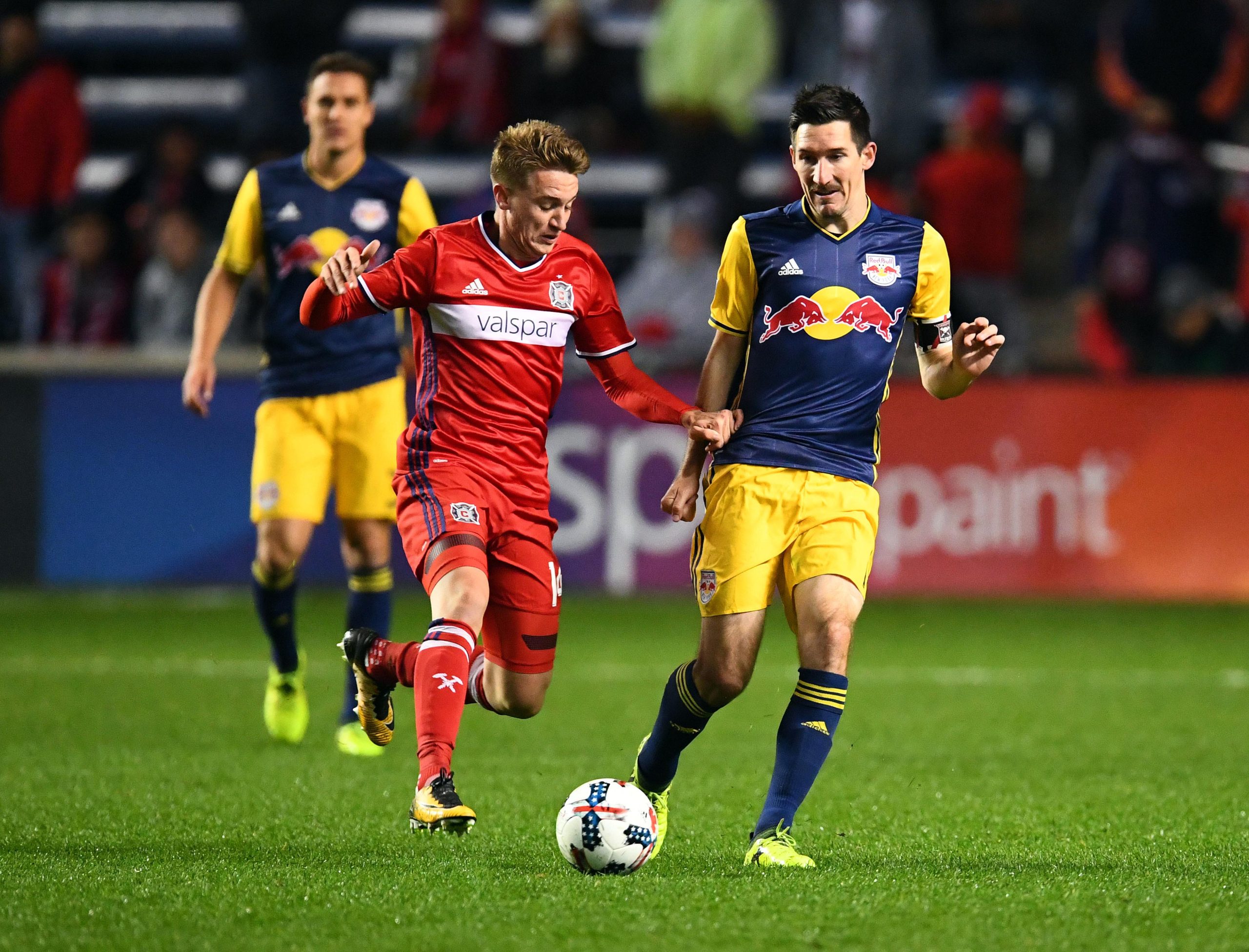 Oct 25, 2017; Chicago, IL, USA;  New York Red Bulls midfielder Sacha Kljestan (16) passes the ball against Chicago Fire midfielder Djordje Mihailovic (14) during the second half at Toyota Park. Mandatory Credit: Mike DiNovo-USA TODAY Sports
