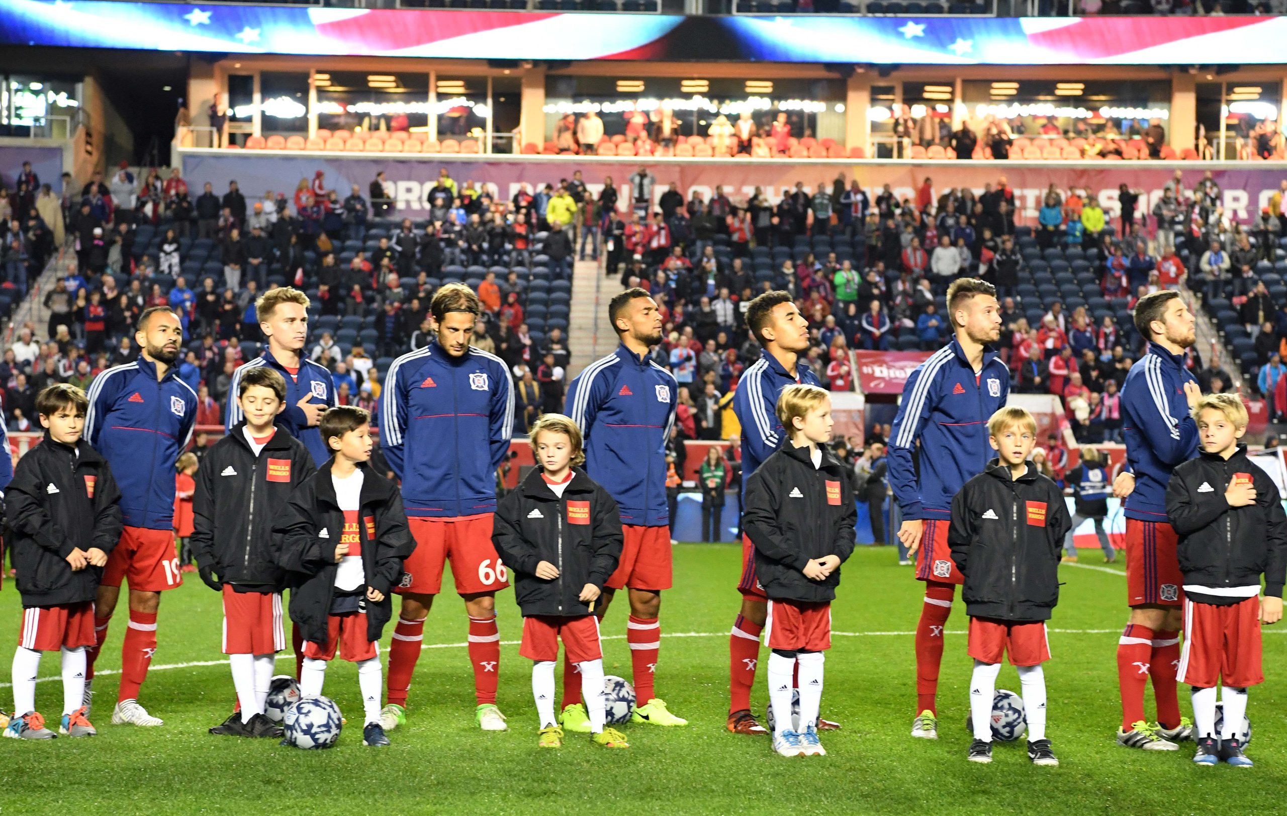 Oct 25, 2017; Chicago, IL, USA; The Chicago Fire stand with the Wells Fargo kids during National Anthem before the game against the New York Red Bulls at Toyota Park. Mandatory Credit: Mike DiNovo-USA TODAY Sports