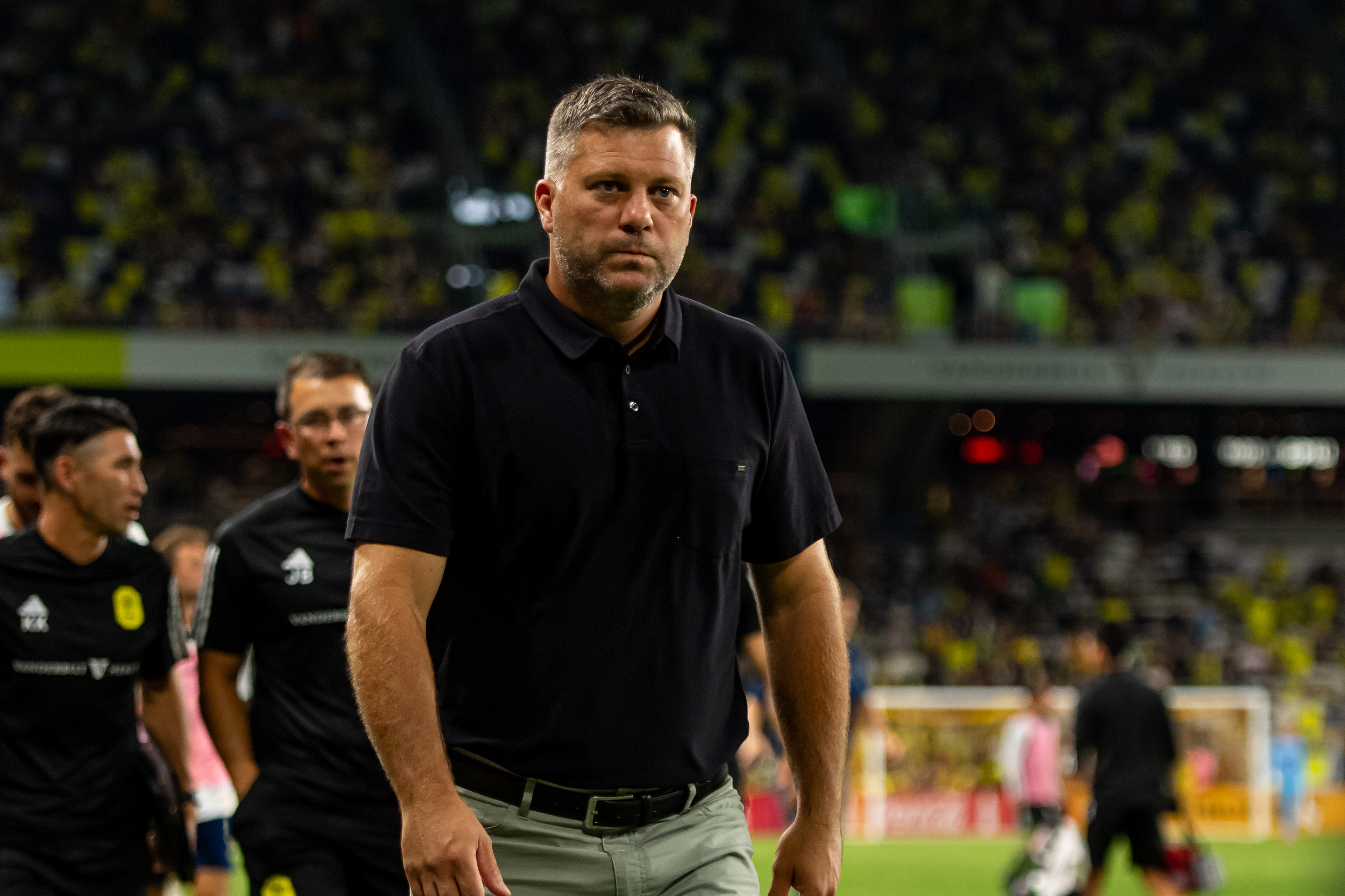 Aug 24, 2024; Nashville, Tennessee, USA; Nashville SC head coach B.J. Callaghan walks off the field at the end of the first half against the Austin FC during the first half at Geodis Park.