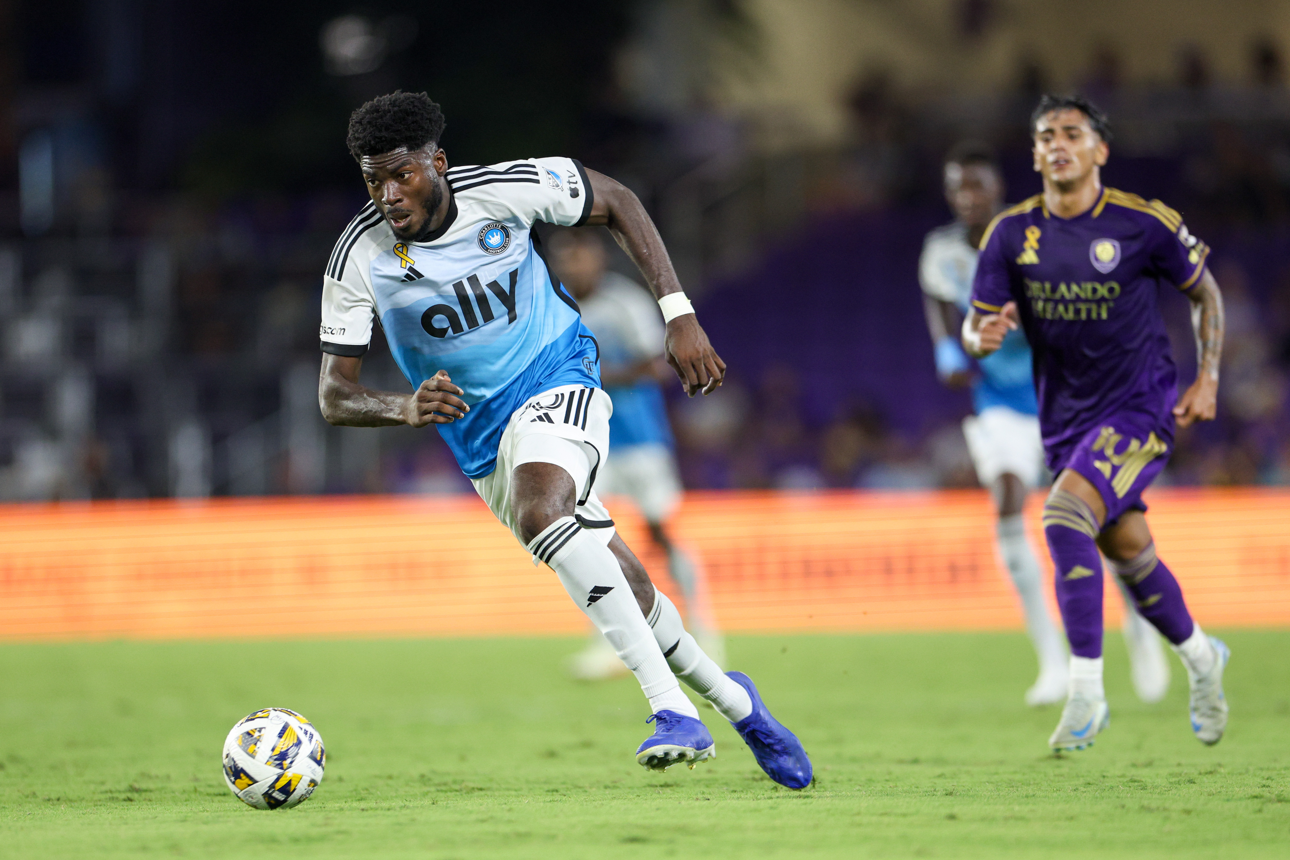 Sep 18, 2024; Orlando, Florida, USA; Charlotte FC forward Patrick Agyemang (33) controls the ball against Orlando City in the first half at Inter&Co Stadium.