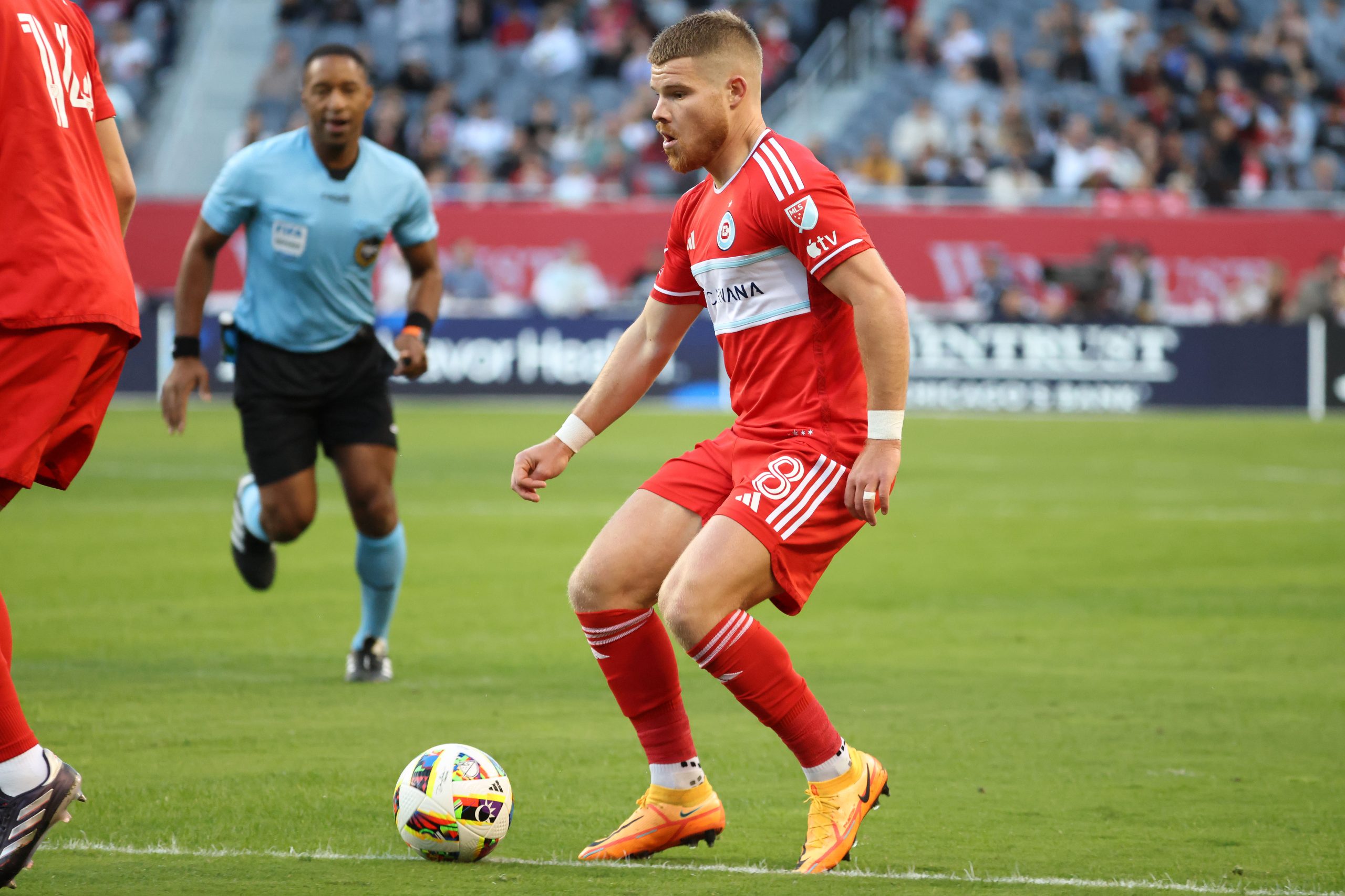 Oct 19, 2024; Chicago, Illinois, USA; Chicago Fire forward Chris Mueller (8) kicks the ball against the Nashville SC during the first half at Soldier Field. Mandatory Credit: Mike Dinovo-Imagn Images