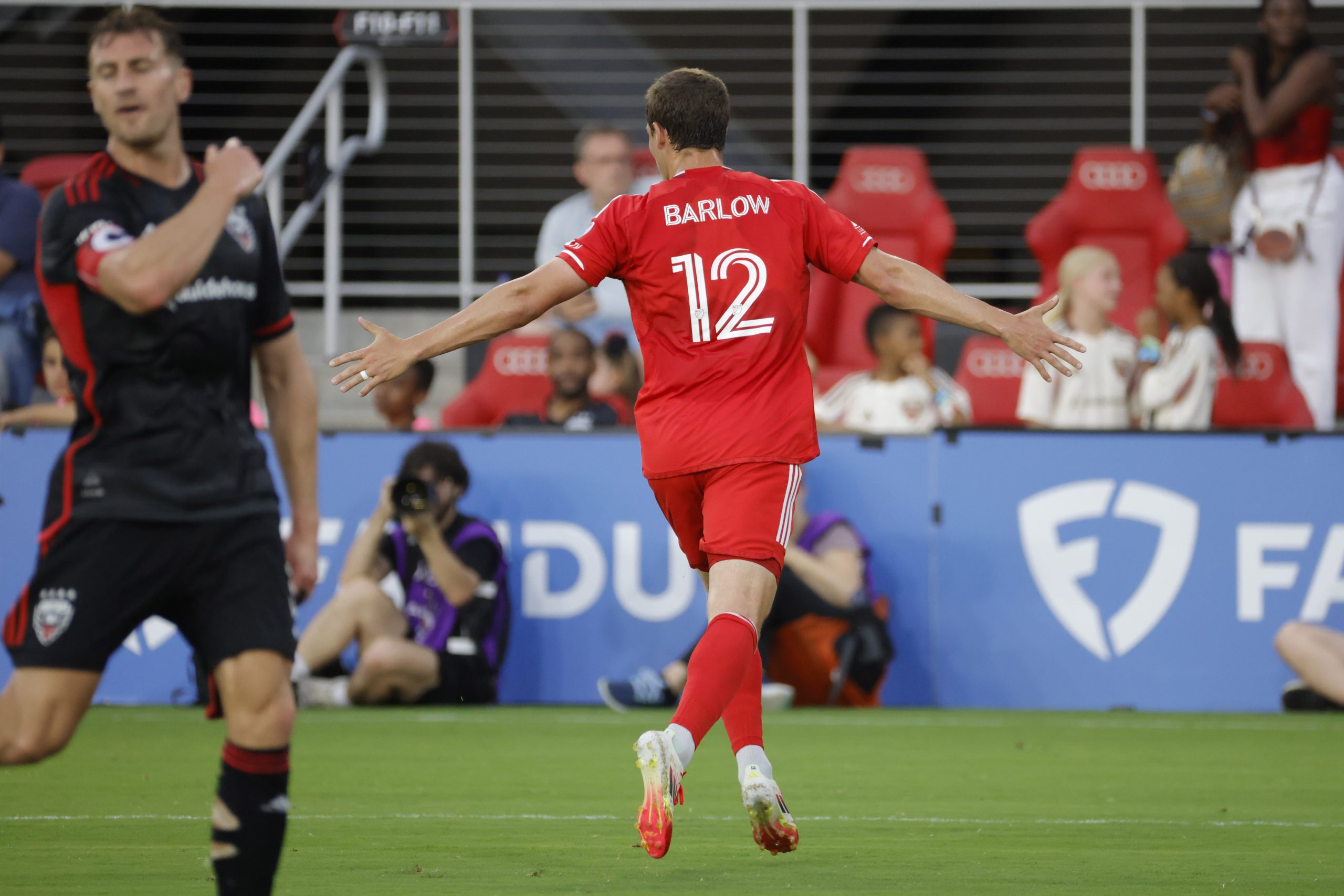 Jun 7, 2025; Washington, District of Columbia, USA; Chicago Fire forward Tom Barlow (12) celebrates after scoring a goal against the D.C. United during the first half at Audi Field. Mandatory Credit: Amber Searls-Imagn Images