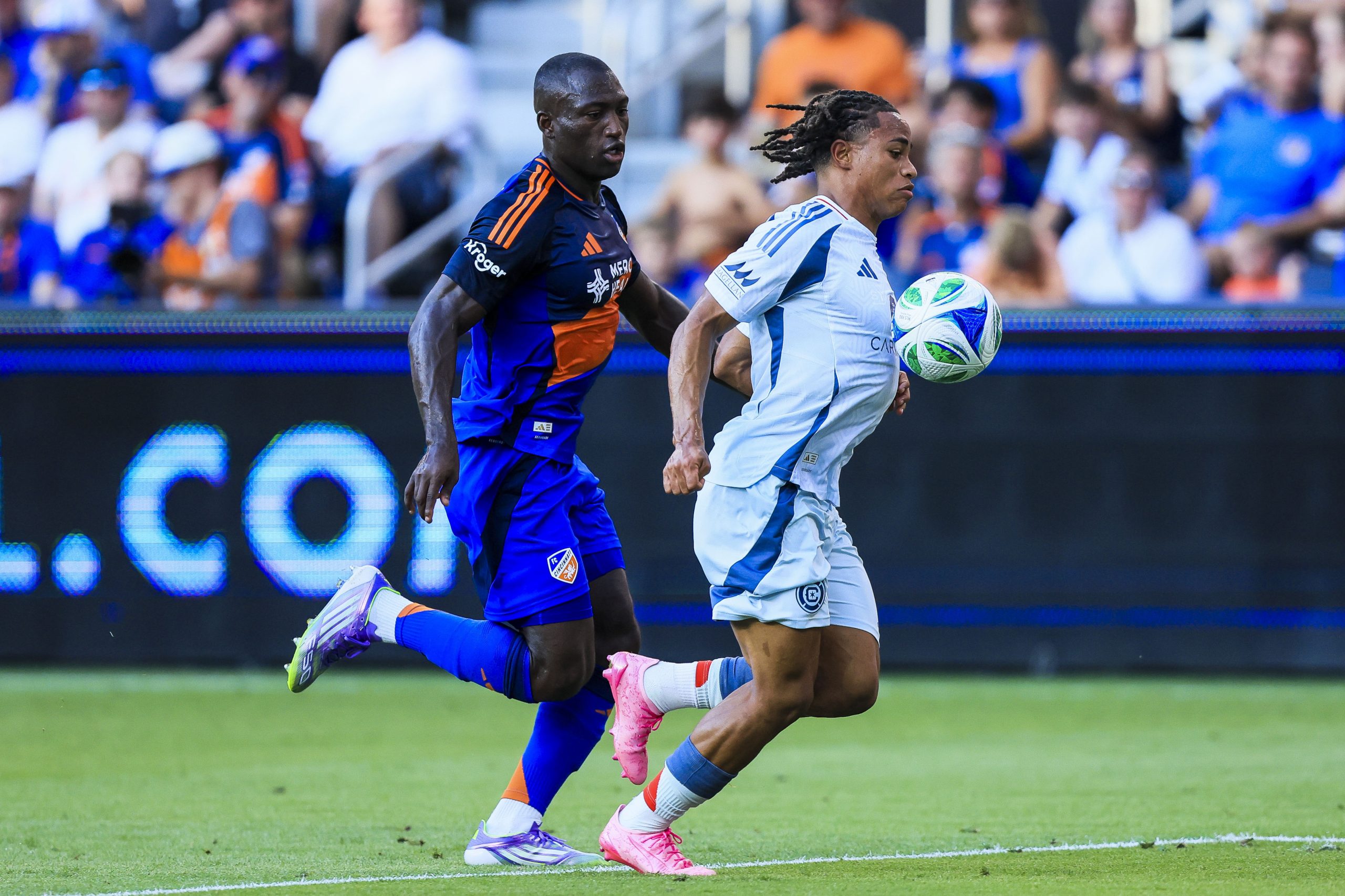 Jul 5, 2025; Cincinnati, Ohio, USA; Chicago Fire FC defender Leonardo Barroso (2) controls the ball against FC Cincinnati forward Kevin Denkey (9) in the first half at TQL Stadium. Mandatory Credit: Katie Stratman-Imagn Images