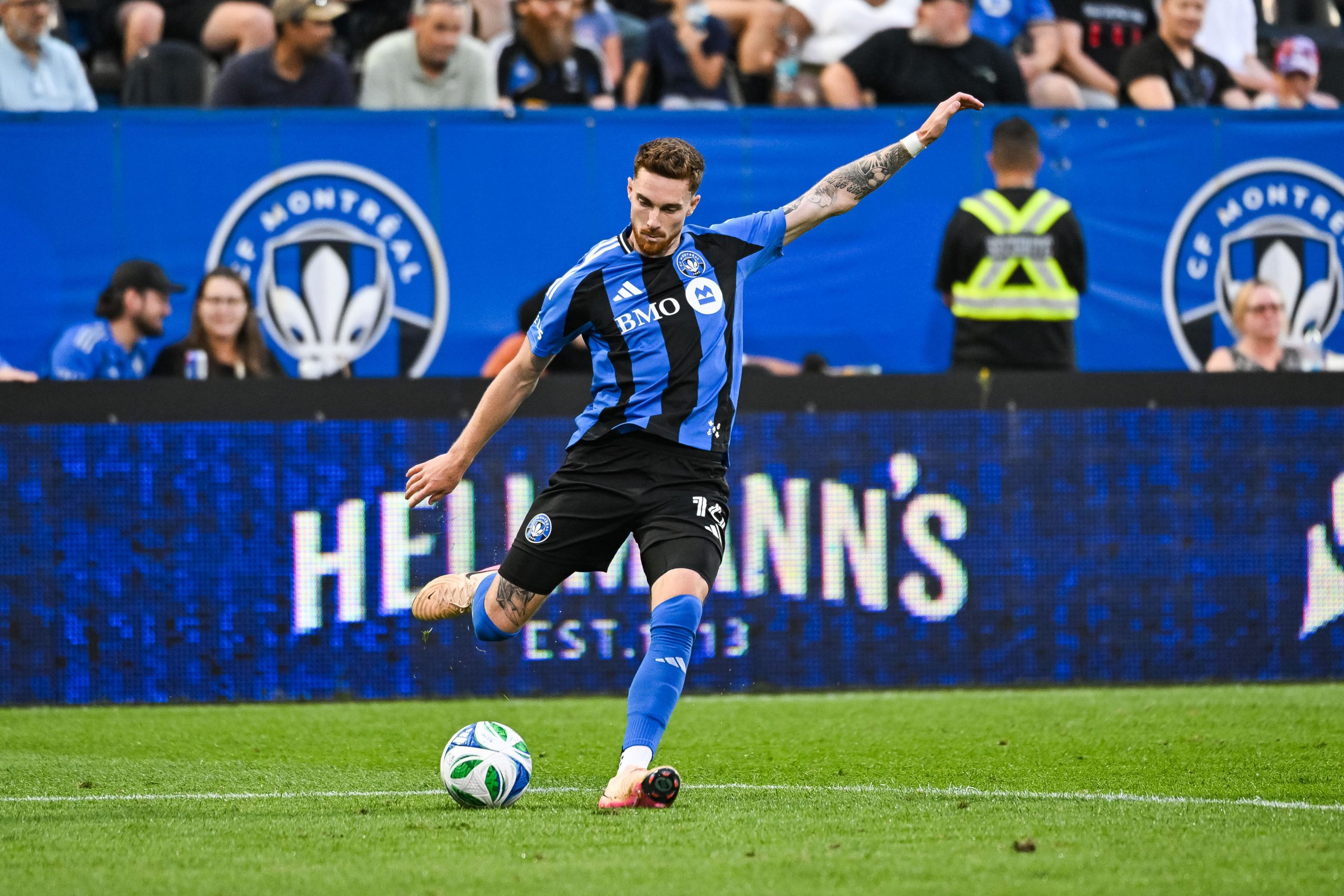 Jul 9, 2025; Montreal, Quebec, CAN; CF Montreal defender Joel Waterman (16) kicks the ball away against Forge FC Hamilton during the second half at Stade Saputo. Mandatory Credit: David Kirouac-Imagn Images