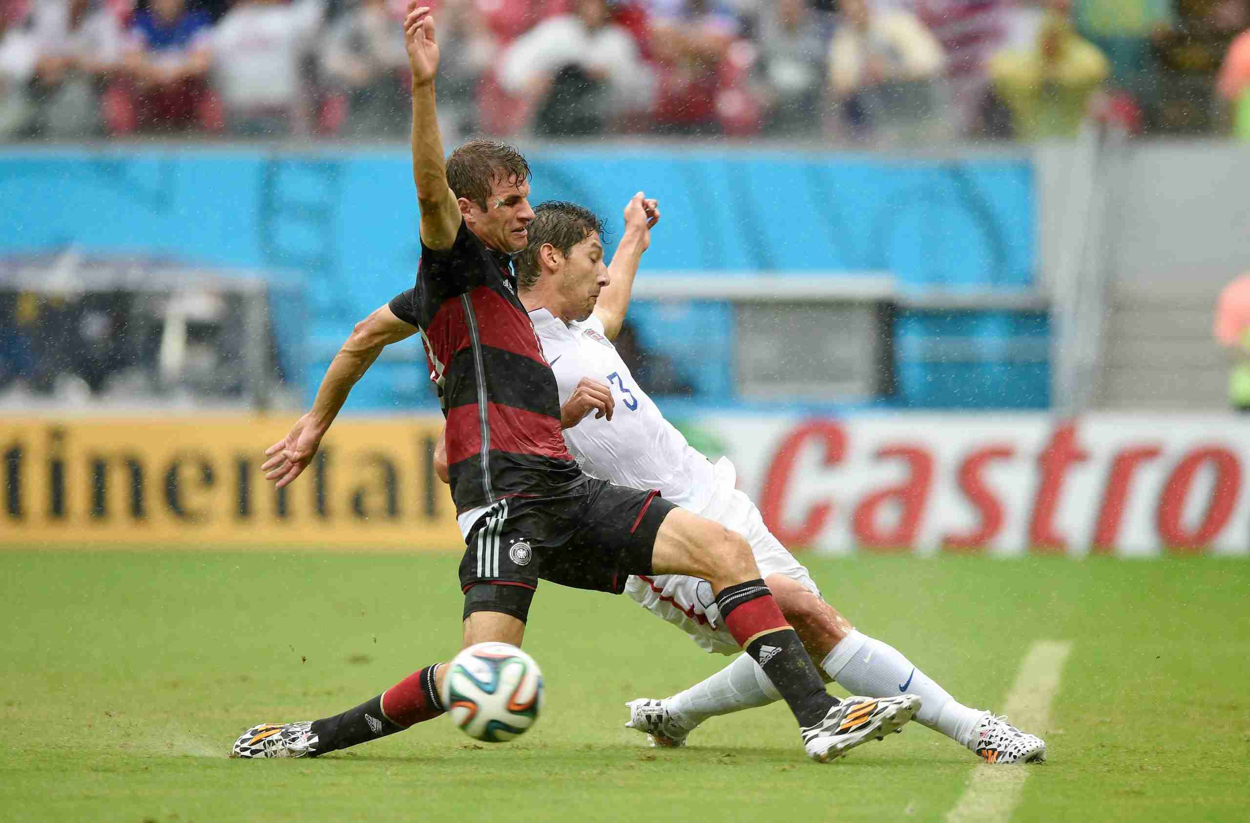 June 26, 2014; Recife, BRAZIL; United States defender Omar Gonzalez (3) and Germany midfielder Thomas Muller (13) go after the ball during the first half of the match during the 2014 World Cup at Arena Pernambuco. 