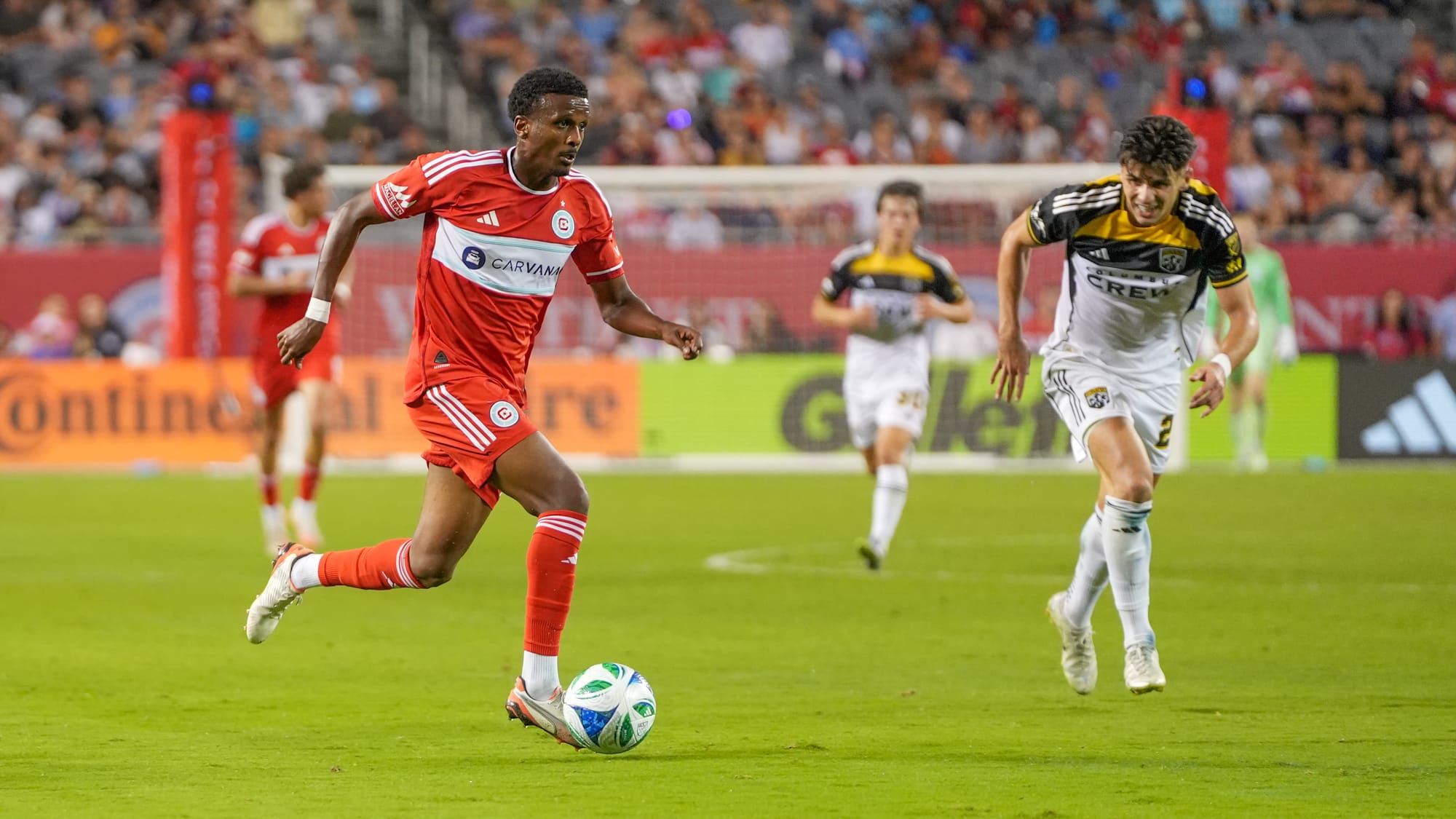 Maren Haile-Selassie of the Chicago Fire dribbles the ball past Max Arfsten of the Columbus Crew at Soldier Field in 2025. (photo: Barbara Calabrese)