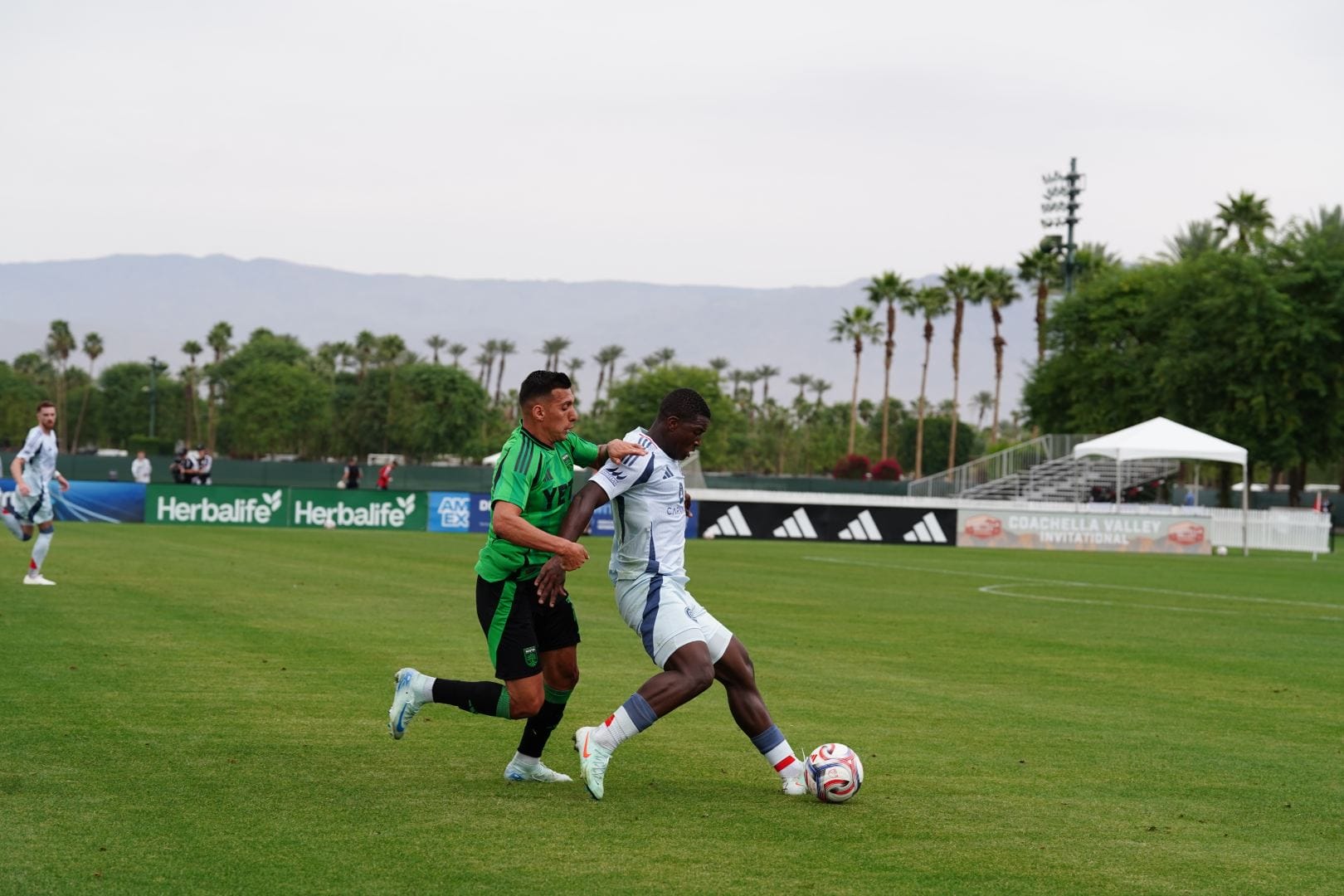 Mbekezeli Mbokazi warding off an Austin defender during a preseason game at the Coachella Valley Invitational on February 11, 2026