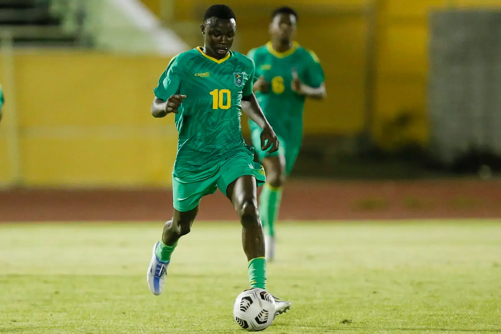 Omari Glasgow advancing the b all for the Guyanese National Team.