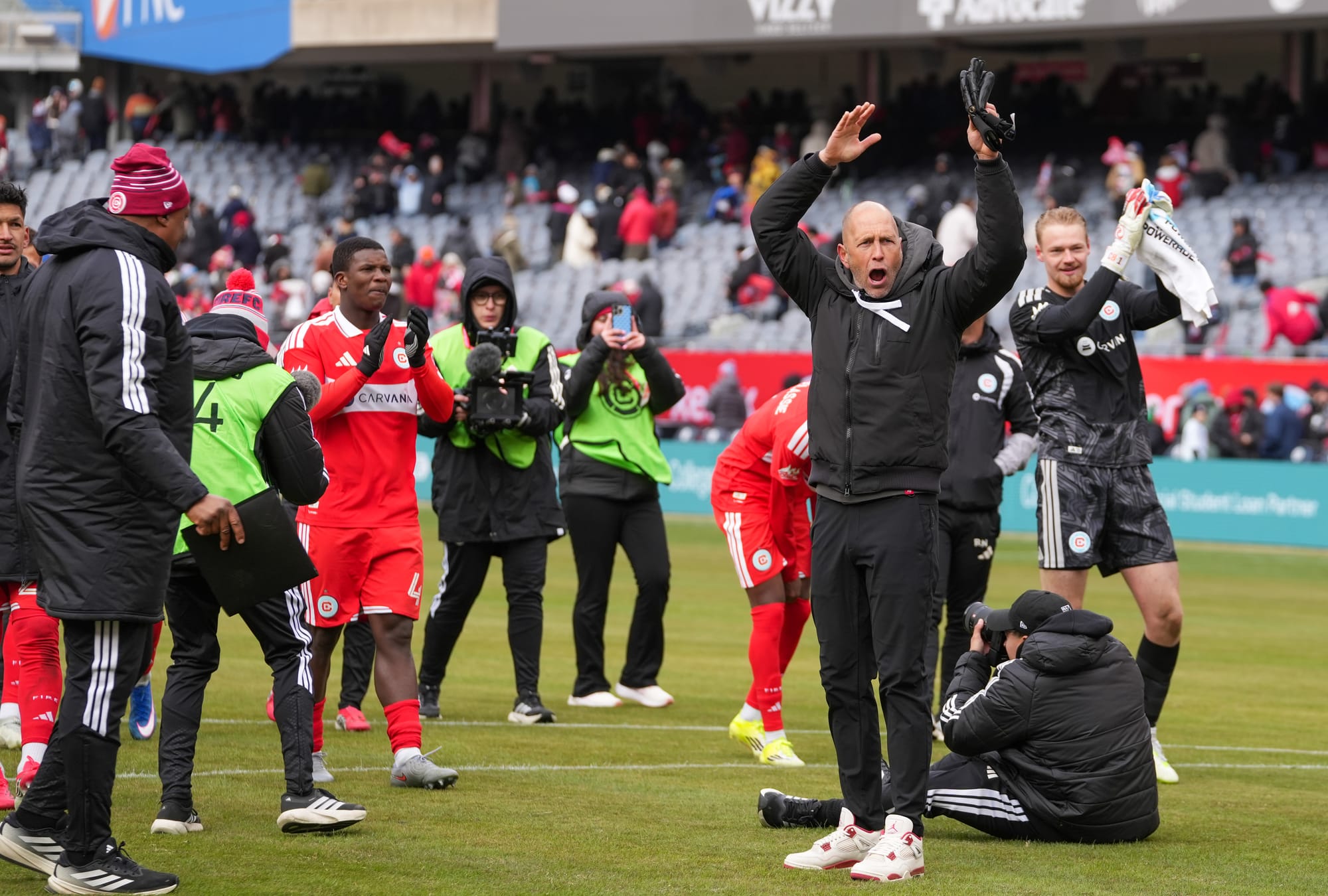 Chicago Fire players and coaches celebrate the team's win over CF Montreal