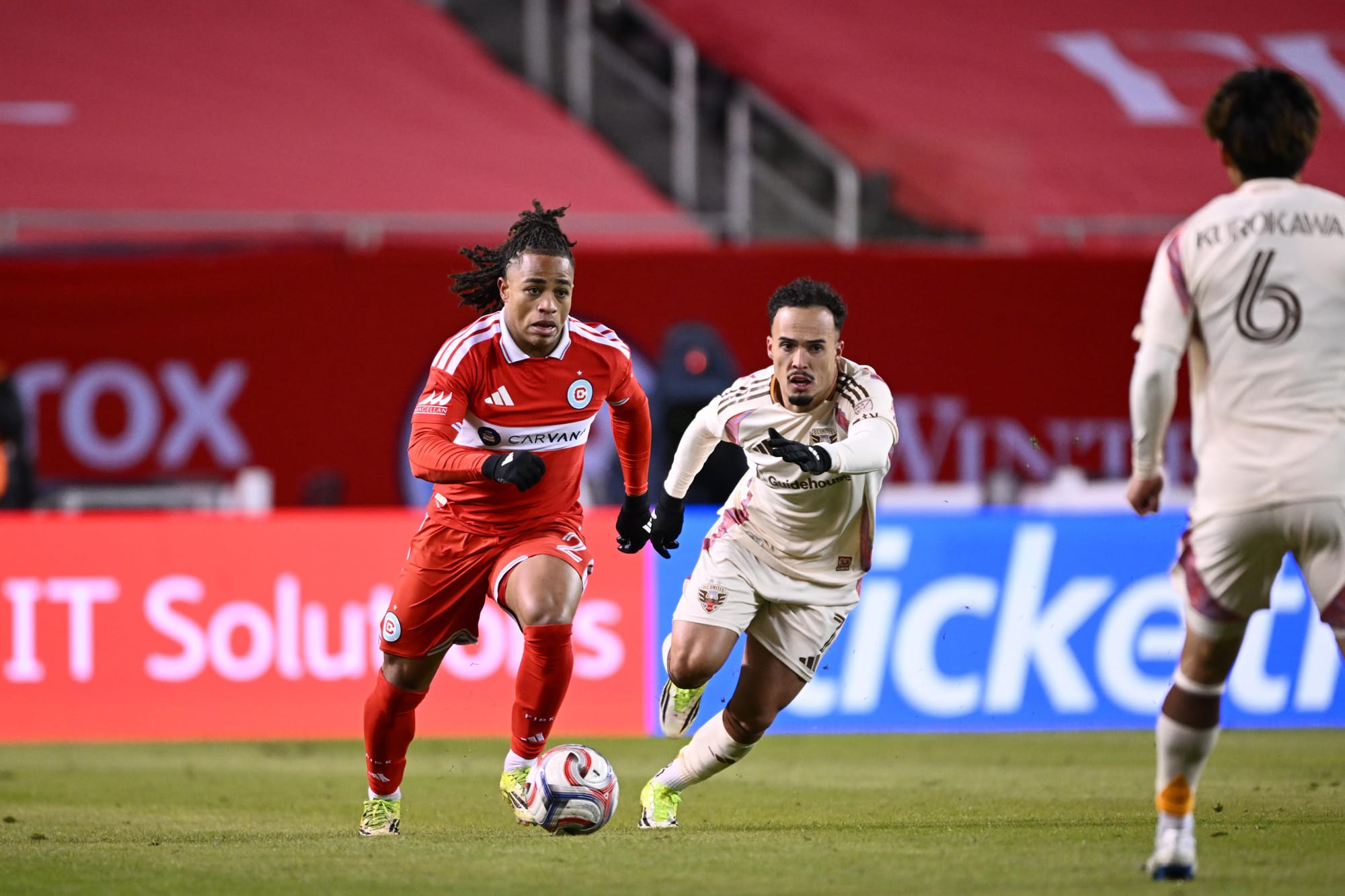 Leonardo Barroso and DC United no. 7 contest the ball at Soldier Field