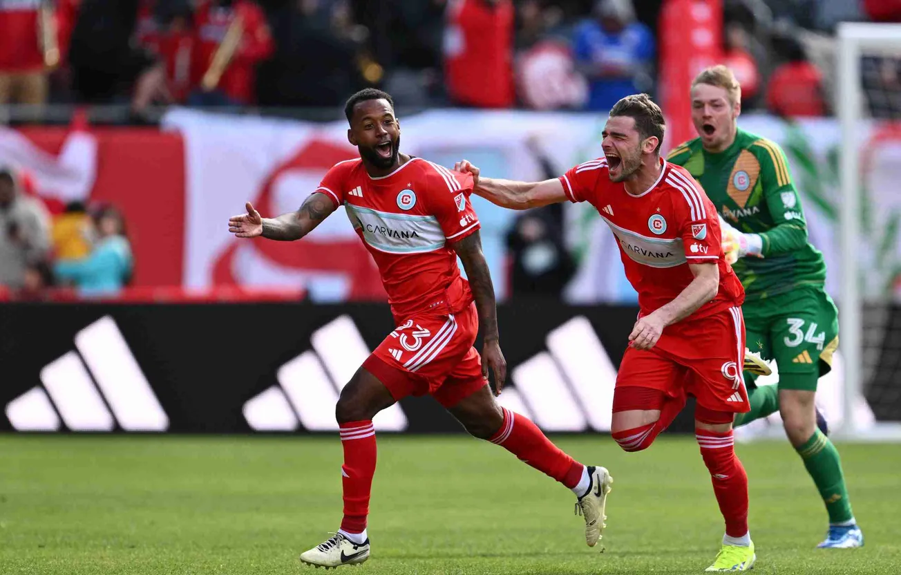 Mar 16, 2024; Chicago, Illinois, USA; Chicago Fire FC midfielder Kellyn Acosta (23) celebrates with goalkeeper Chris Brady (3