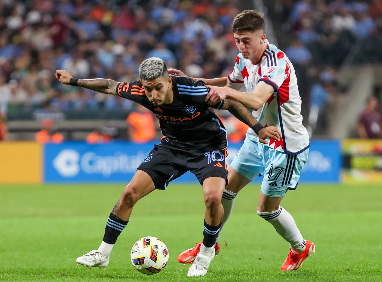 Aug 24, 2024; Queens, New York, USA; New York City midfielder Santiago Rodrguez (10) and Chicago Fire midfielder Brian Guti