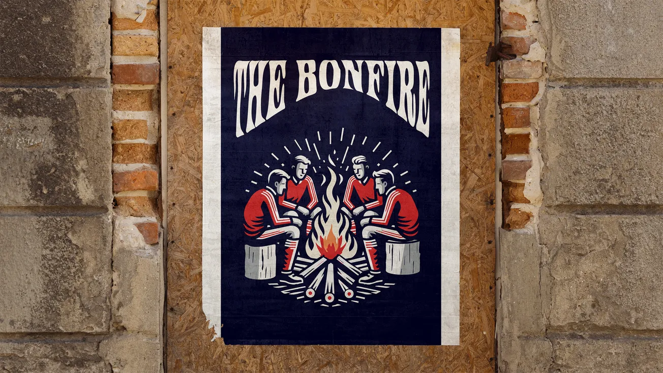 Poster that says "The Bonfire" on a piece of OSB in a brick opening surrounded by a stucco wall.
